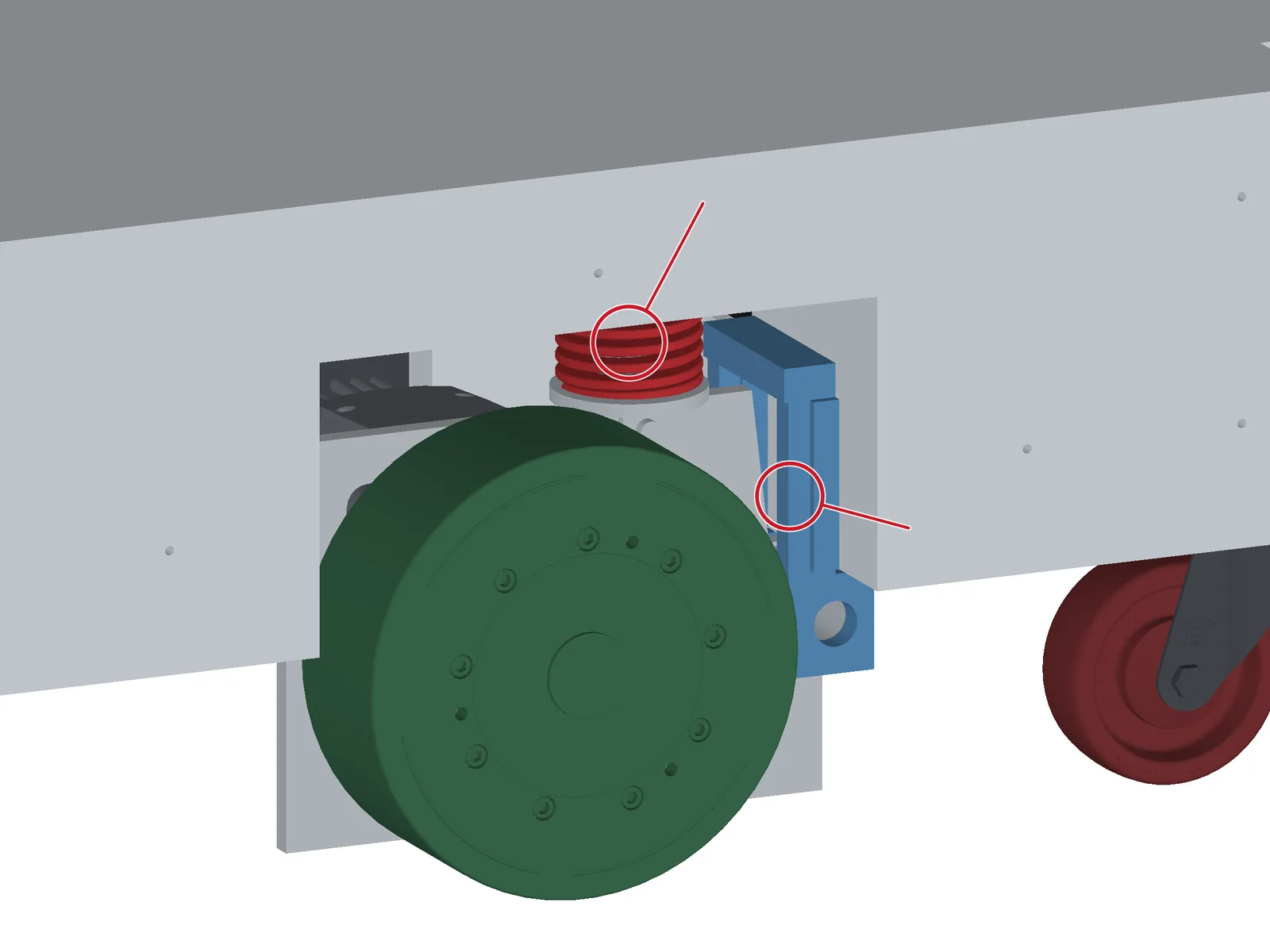 Close view of a drive unit: green tread, red die spring, blue pivot bracket.